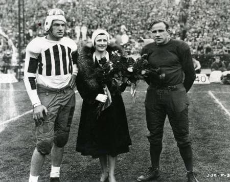 Alabama's Charles Clement and Elmer Schwartz of Washington State, meet with actress Irene Dunne prior to the 1931 Rose Bowl.